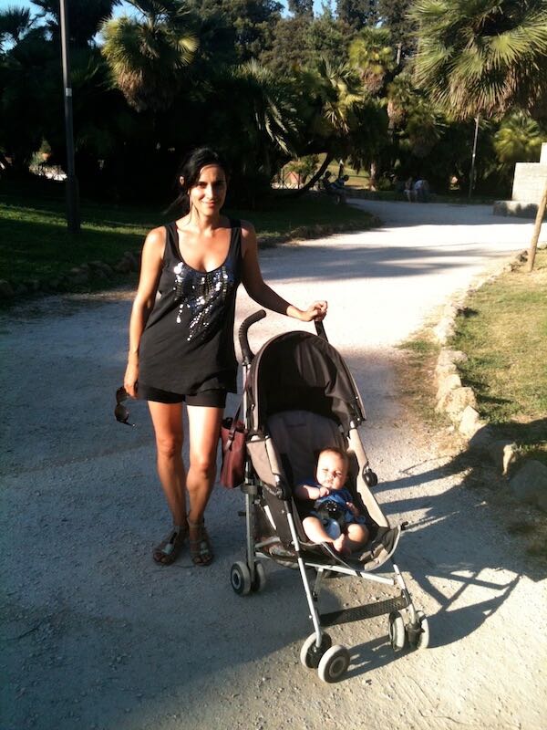 My and my baby in her stroller in Rome, Italy, on a hot summer day