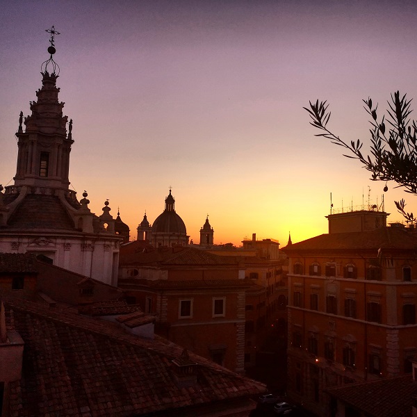 Sunset from Rome terrace with dome of St Ivo church 