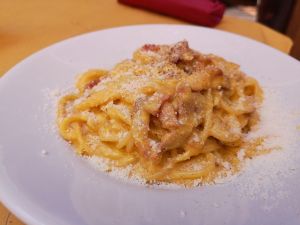 pasta carbonara on white plate