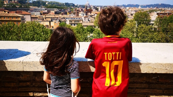 Children admiring view over Rome on a sunny day
