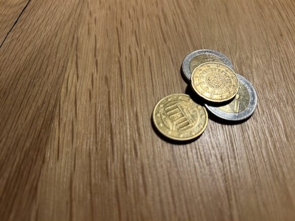 Euro coins on wooden table