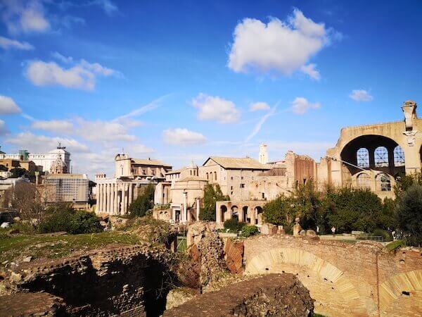 The Roman Forum on a sunny day with The Vittoriano monument in the background