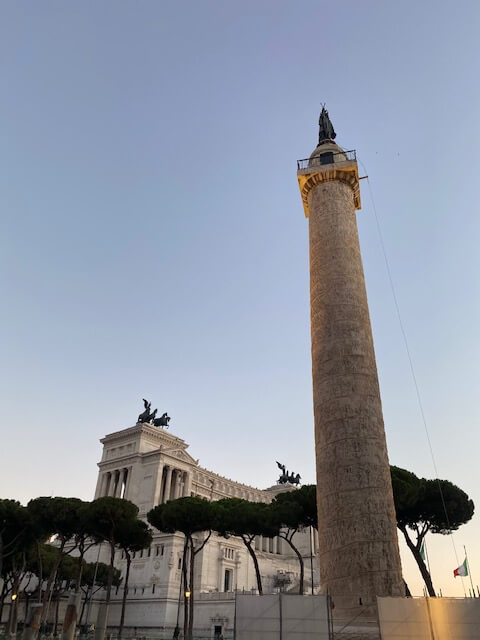 Trajan's column with the Vittoriano and Piazza Venezia in the background at sunset
