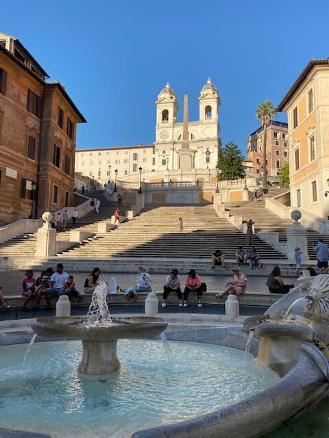 Piazza di Spagna (Spanish Steps) Rome with fountain at the forefront and the steps and the church of Trinita' dei Monti in the background