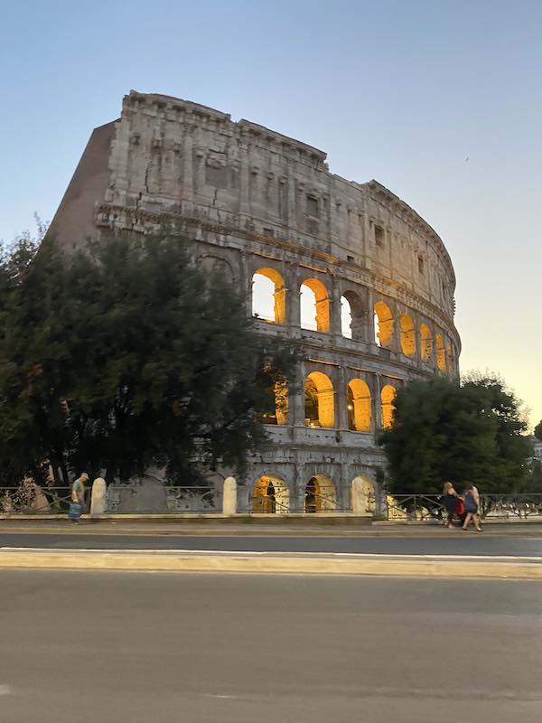 Rome Colosseum in the early evening with its arches lit up