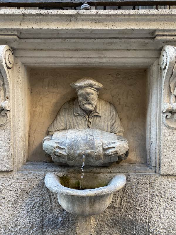 fountain of the porter aka Il facchino, represented as a man carrying a small barrel