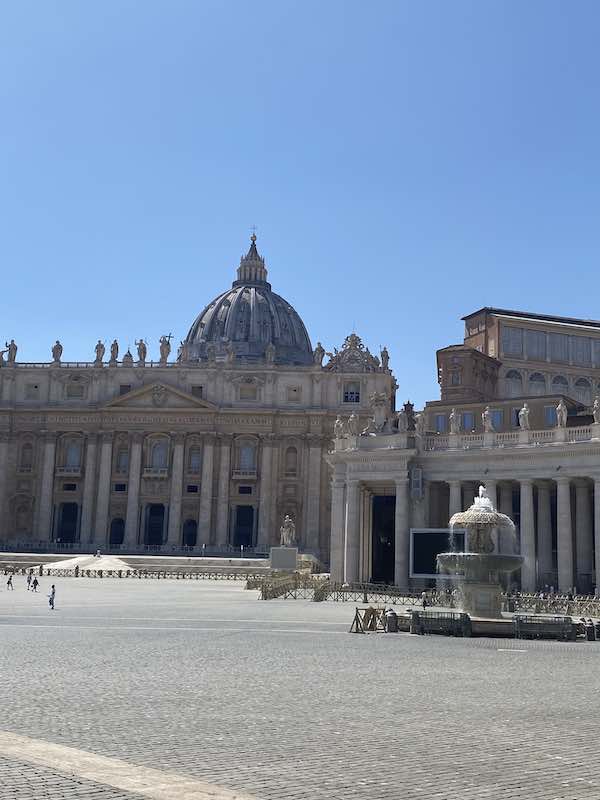 St Peter square with Saint Peter Basilica, colonnade and fountain in the foreground
