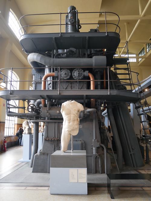 Statue and machine in Centrale Montemartini Museum, Rome