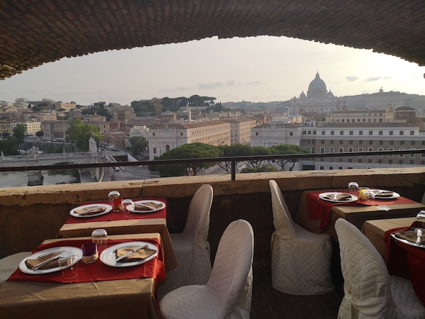 restaurant table with view over St Peter Dome in Castel Sant'Angelo Rome