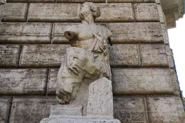 statue of Pasquino in Rome representing the bust and head of a young man, one of the talking statues of Rome