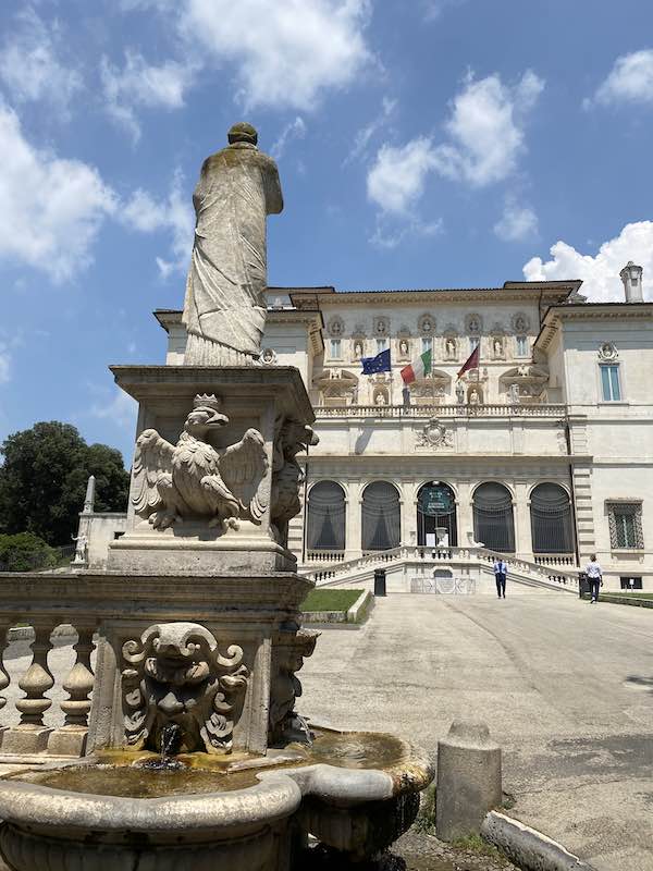 Facade of Borghese Gallery in Rome with statue in front