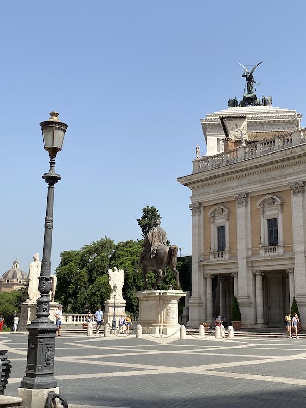 Piazza del Campidoglio Rome, in summer, with statue of winged Victory in the background
