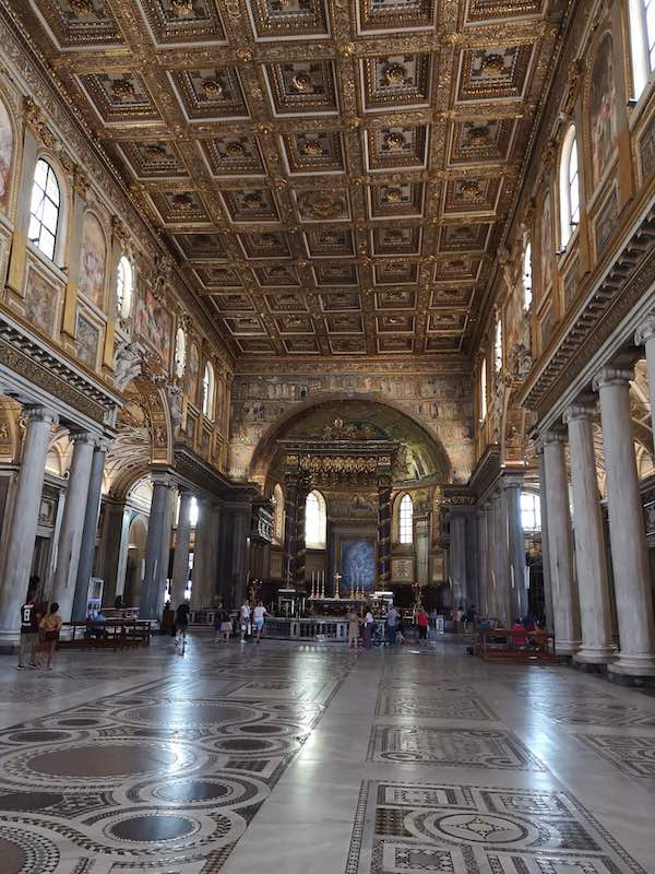 The main nave in Santa Maria Maggiore and its elaborate golden ceiling