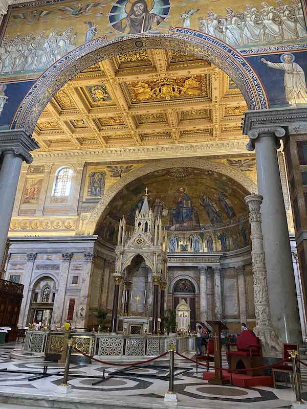 The main altar in Saint Paul Outside the walls in Rome with baldaquin and mosaics