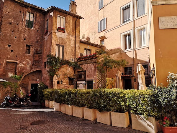 Historical corner in then Jewish Ghetto of Rome with traditional restaurant with outdoor tables