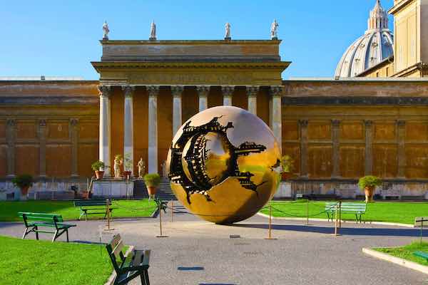 Sculpture of golden sphere in the Vatican yard on the way to visit the Sistine chapel 