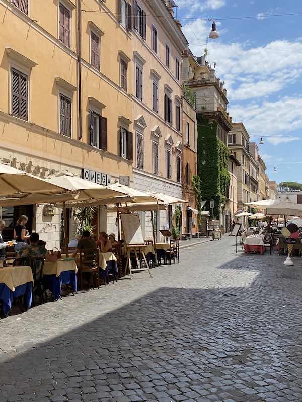 Borgo Pio Rome, pretty street with cobbles and orange / ochre coloured houses