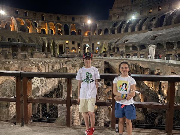 Our children at night in the Colosseum, Rome. 