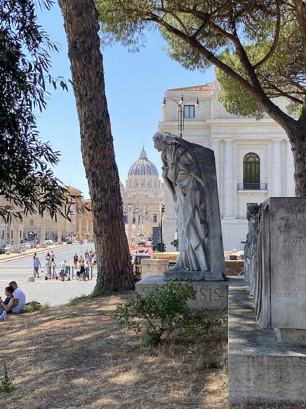 Via della Conciliazione Vatican City Rome with the dome of St Peter's in the background and statue of St Catherine's in the foreground