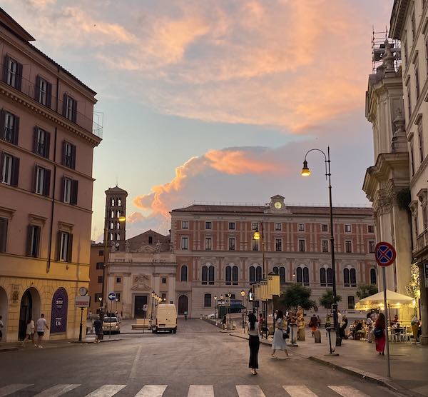 Sunset in Rome city center over beautiful buildings and bell tower