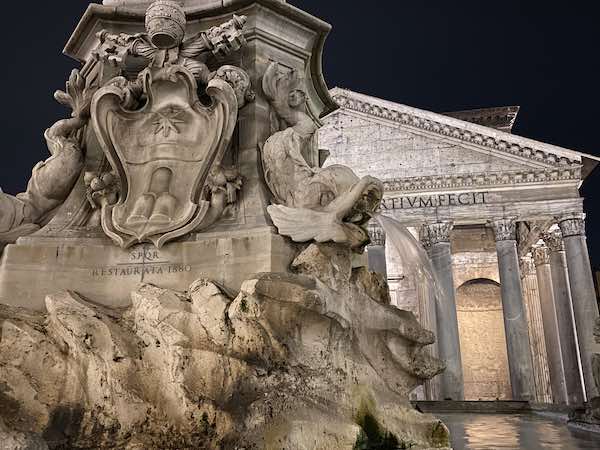 Detail of marine animals on the fountain in front of the Pantheon in Rome, at night