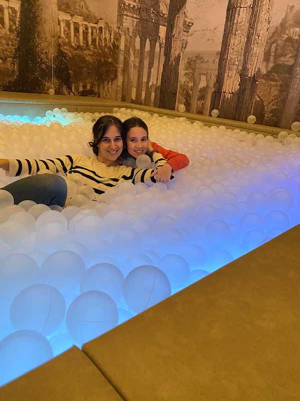 My daughter and I in a swimming pool of plastic sphere in Ikono Rome interactive experience