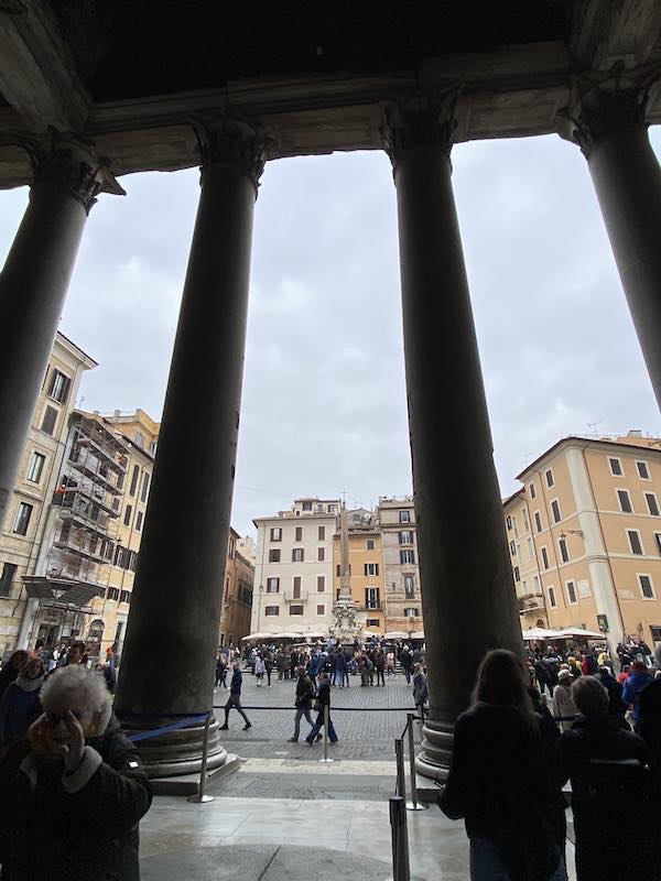 Piazza del Pantheon as seen from inside the monument, with the large pantheon columns in front of you