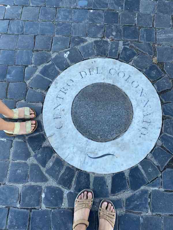 My feet and my daughter's feet in sandals in Rome