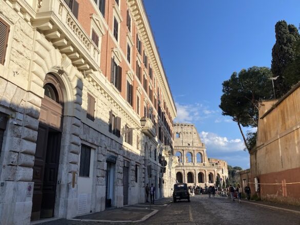Cobbles street in Monti with Colosseum in the background